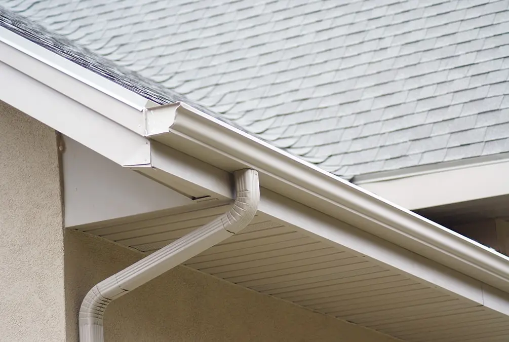 Custom-fit seamless gutters installed on a residential home, ensuring effective water drainage and roof protection.