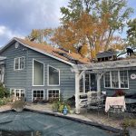 Roof replacement in progress by DNS Exterior on a residential home in Lockport, IL, with old shingles removed and new roofing materials being installed.